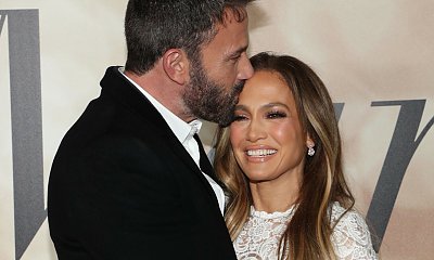 52-letnia Jennifer Lopez w białej mini kusi nogami na ściance i wtula się w Bena Afflecka