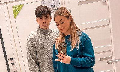 Sylwia Przybysz olśniła kreacją na premierze w Paryżu! Wszyscy jednak patrzą na kolor garnituru Janka...