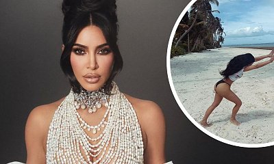 Kim Kardashian na plaży fika. Przerzut bokiem w stringach opanowała do perfekcji