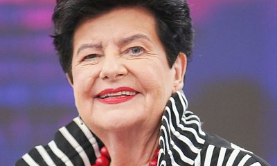 Pani Joanna wdzięczyła się przed obiektywami. Były korale i obcisłe, skórzane spodnie, które wyeksponowały jej kobiecość