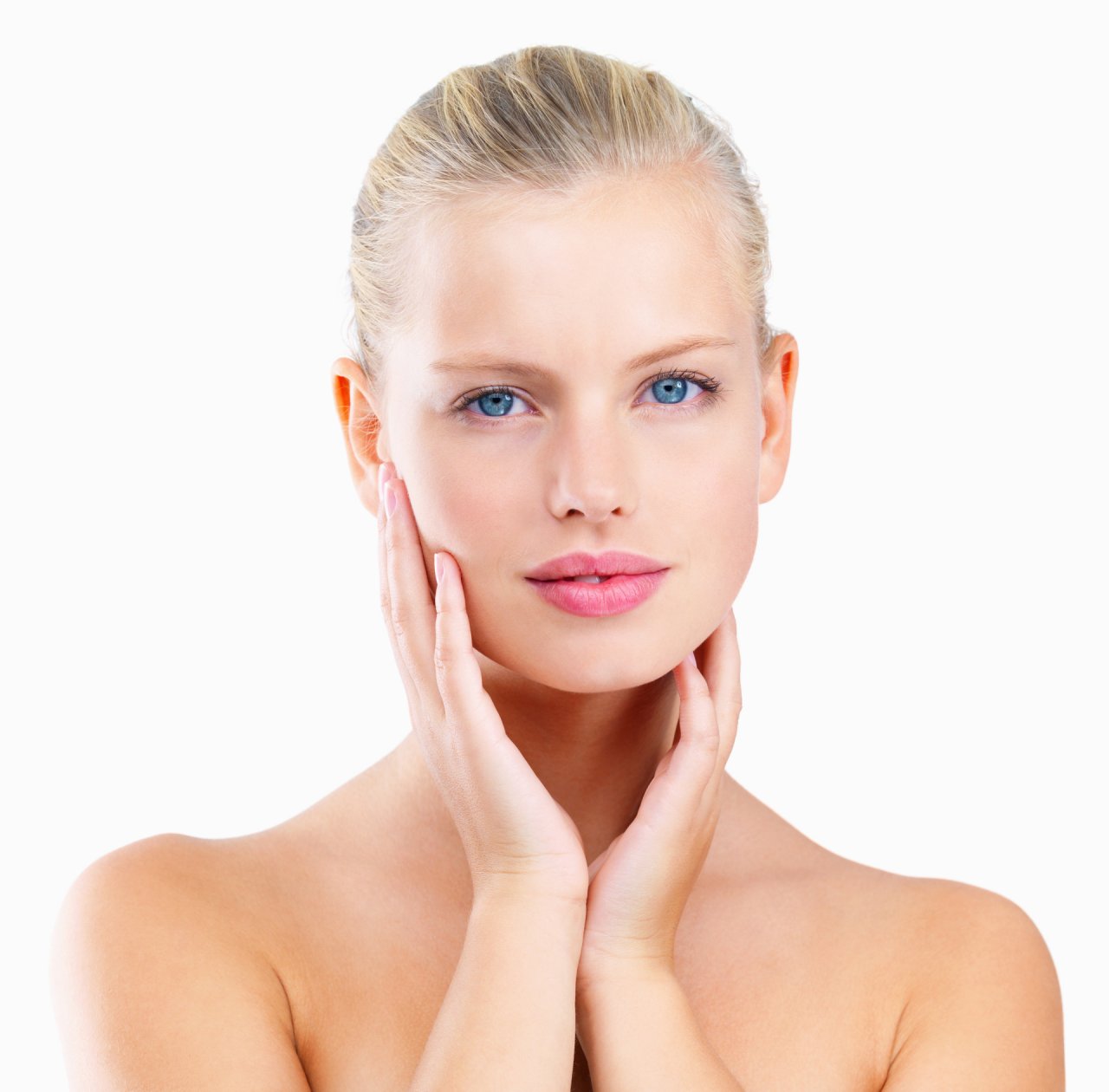 Closeup of a happy young beautiful woman with hands on face
