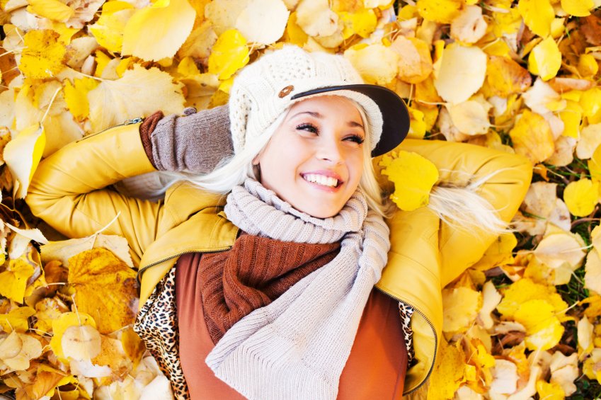 Beautiful woman enjoying in a sunny autumn day.