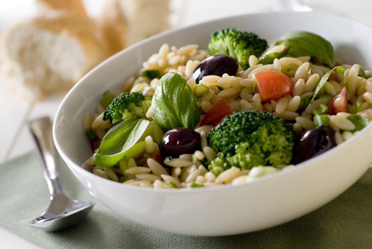 orzo pasta salad with fresh herbs and vegetables.