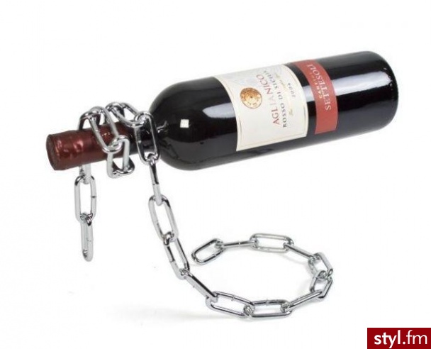 Stojak na butelkę wina wykonany z nikowanego metalu. Dzięki niemu butelka wygląda, jakby znajdowała się w powietrzu :) Cena: 119 zł - Gadżety Inne Moda