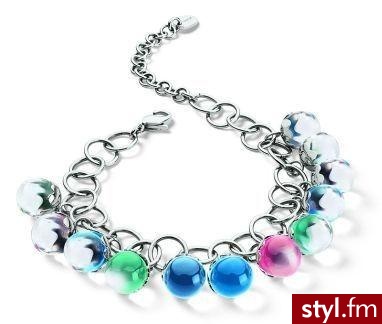 Prezentowany zestaw nosi nazwę Trickle Light i przypomina trochę błyskotki małej dziewczynki. Marka Swatch proponuje skrzyżowanie zabawek z biżuterią oraz dziecięcego uroku z damską elegancją. - Pozostałe Dodatki Moda