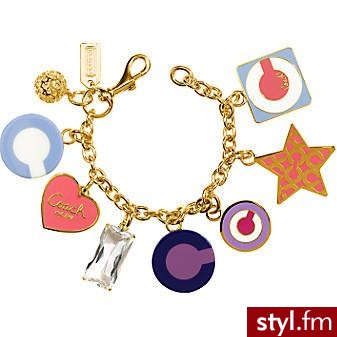 Bronsoletka wykonana ze złota, emalii i szkła.
Coach - 228$ - Pozostałe Dodatki Moda